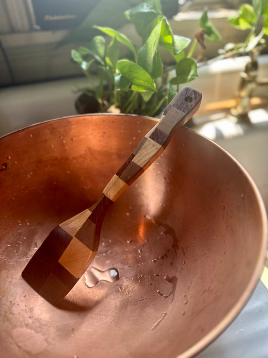 Hand-carved, South African harvested olive wood, African walnut, Maine harvested flame birch, and Brazilian harvested king wood spatula.